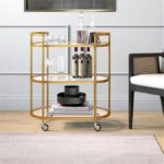 Henn&Hart 30″ Wide Oval Bar Cart in Brass, Bar Carts for the Home | Sleek rolling shelving unit that moves room to room with ease, doubling as a stylish bar cart or convenient coffee station
